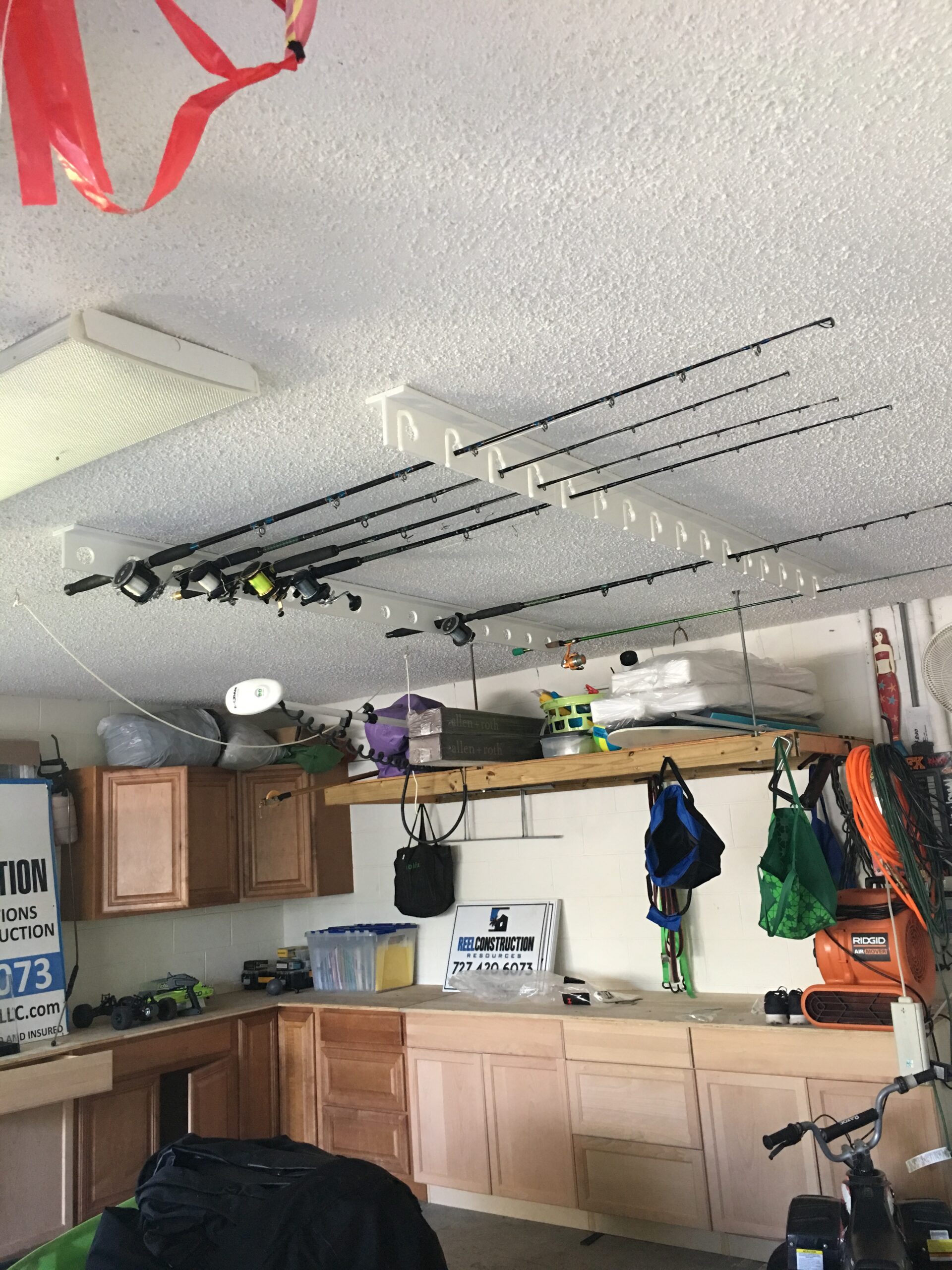 Fishing rod holder for garage